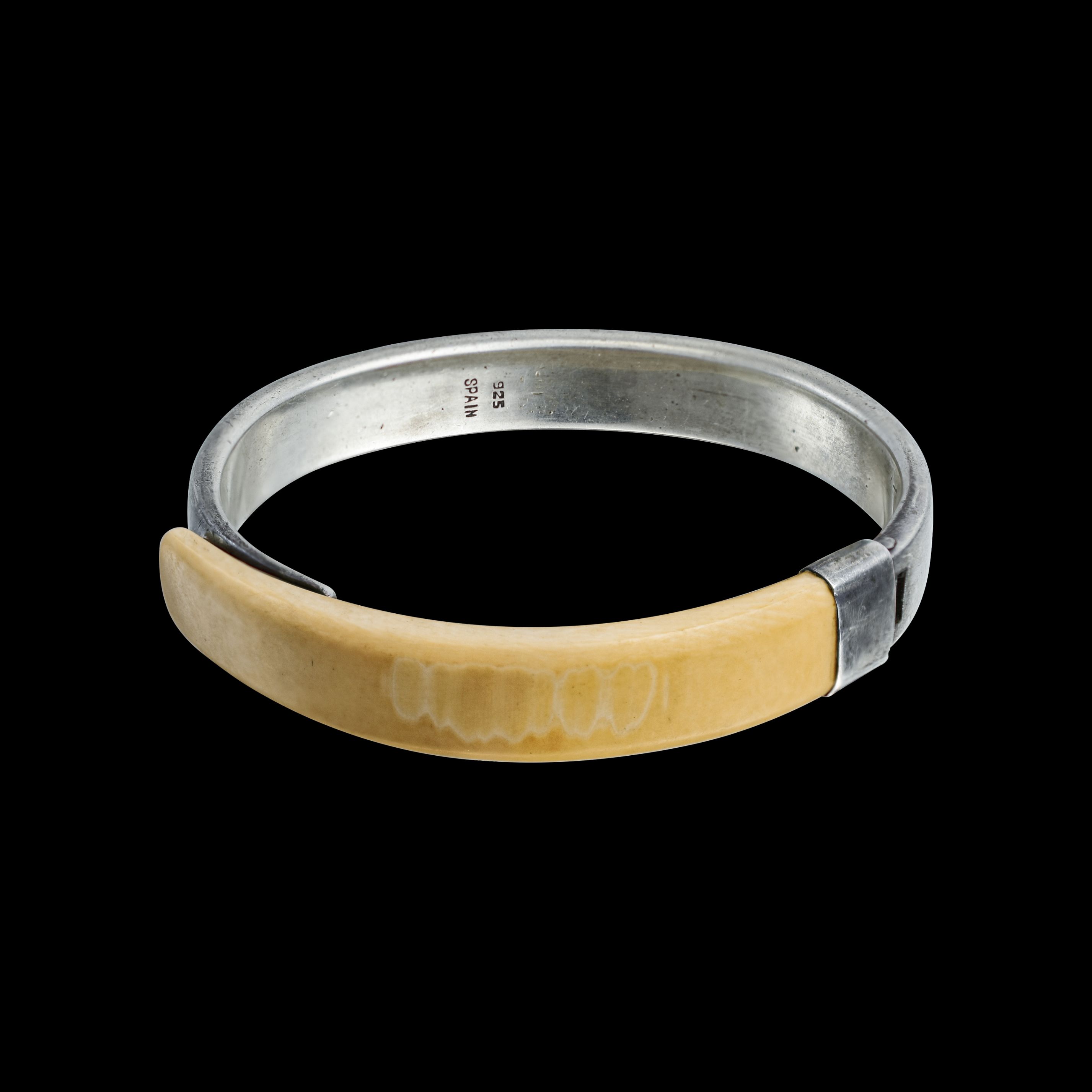- A sterling silver and ivory bangle